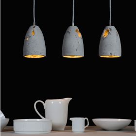 PHOEBE EROSION concrete pendant light Mehrfach abgehngt zur Beleuchtung von lnglichen Esstischen.