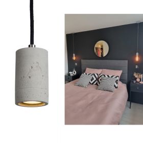 KNALLA SIMPLE Zylindrisches Beton Lampenpendel Betonfarbe Natur in Kombination mit einem dicken, schwarzem Baumwollkabel.